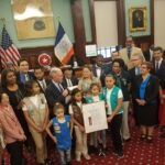 Girl Scouts visit the NYC Council and stand with Council Member Van Bramer.